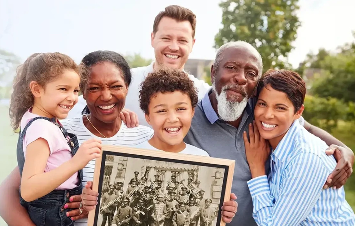 family holding ancestry photo