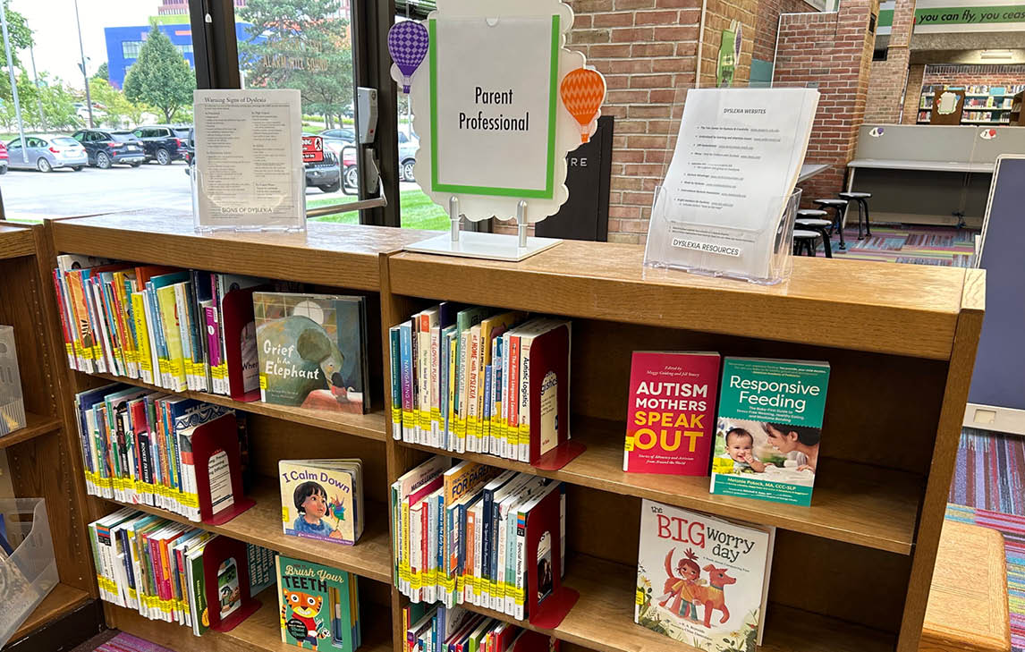 parent professional sign on top of bookshelf